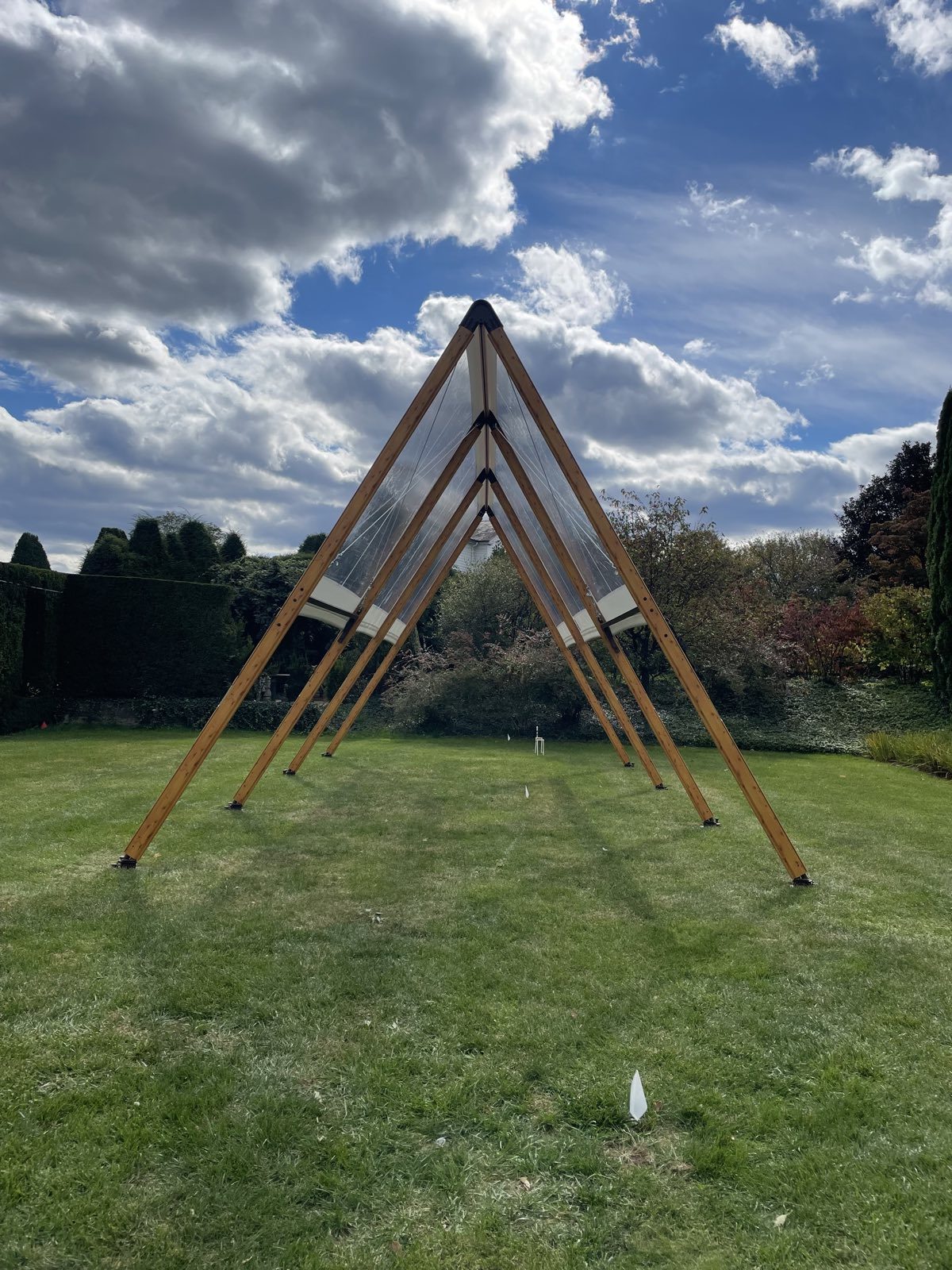 Adena A-frame tent silhouettes on a lawn
