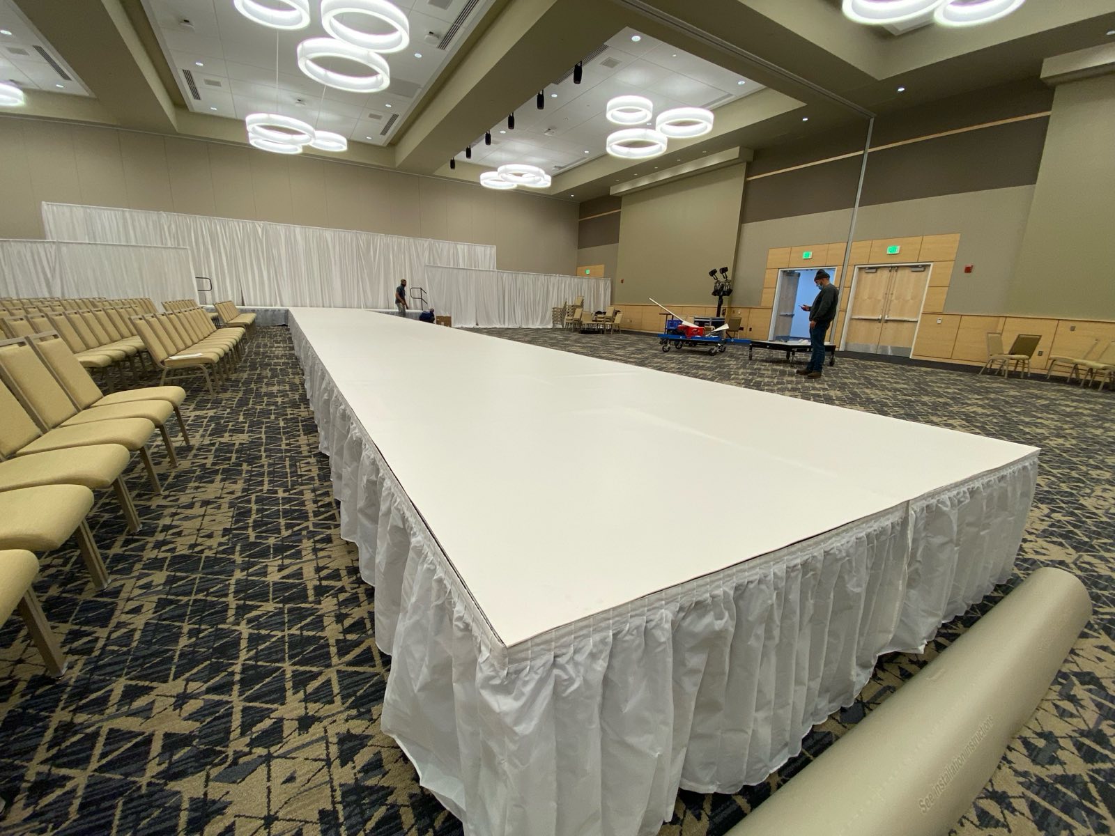 Draped runway staging in a hotel ballroom