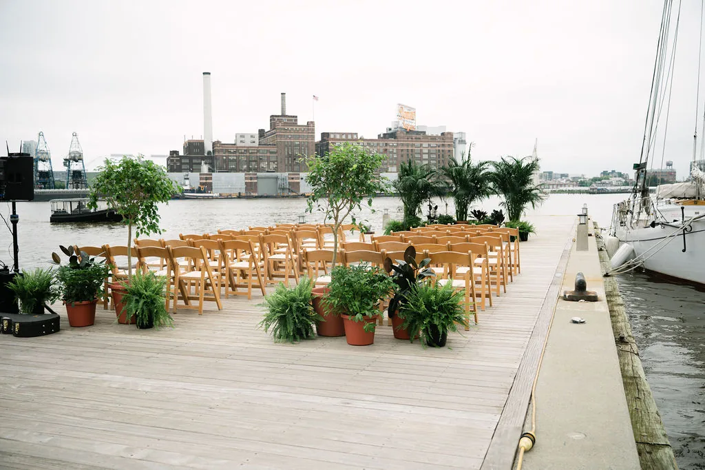 Waterfront wedding ceremony seating beside the harbor