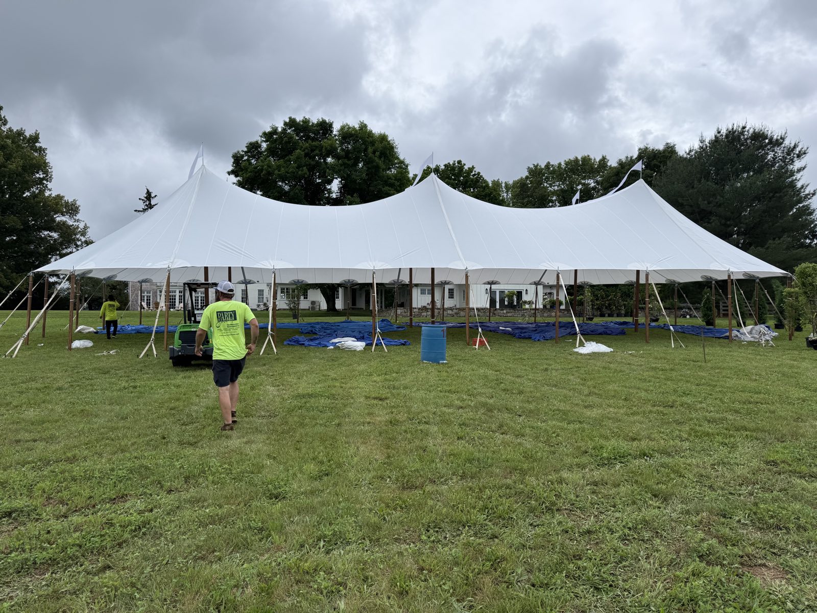 Party Party crew raising a sailcloth tent