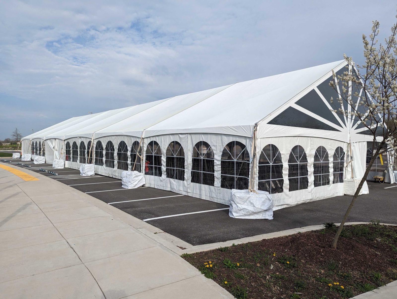 Frame tent with arched window sidewalls