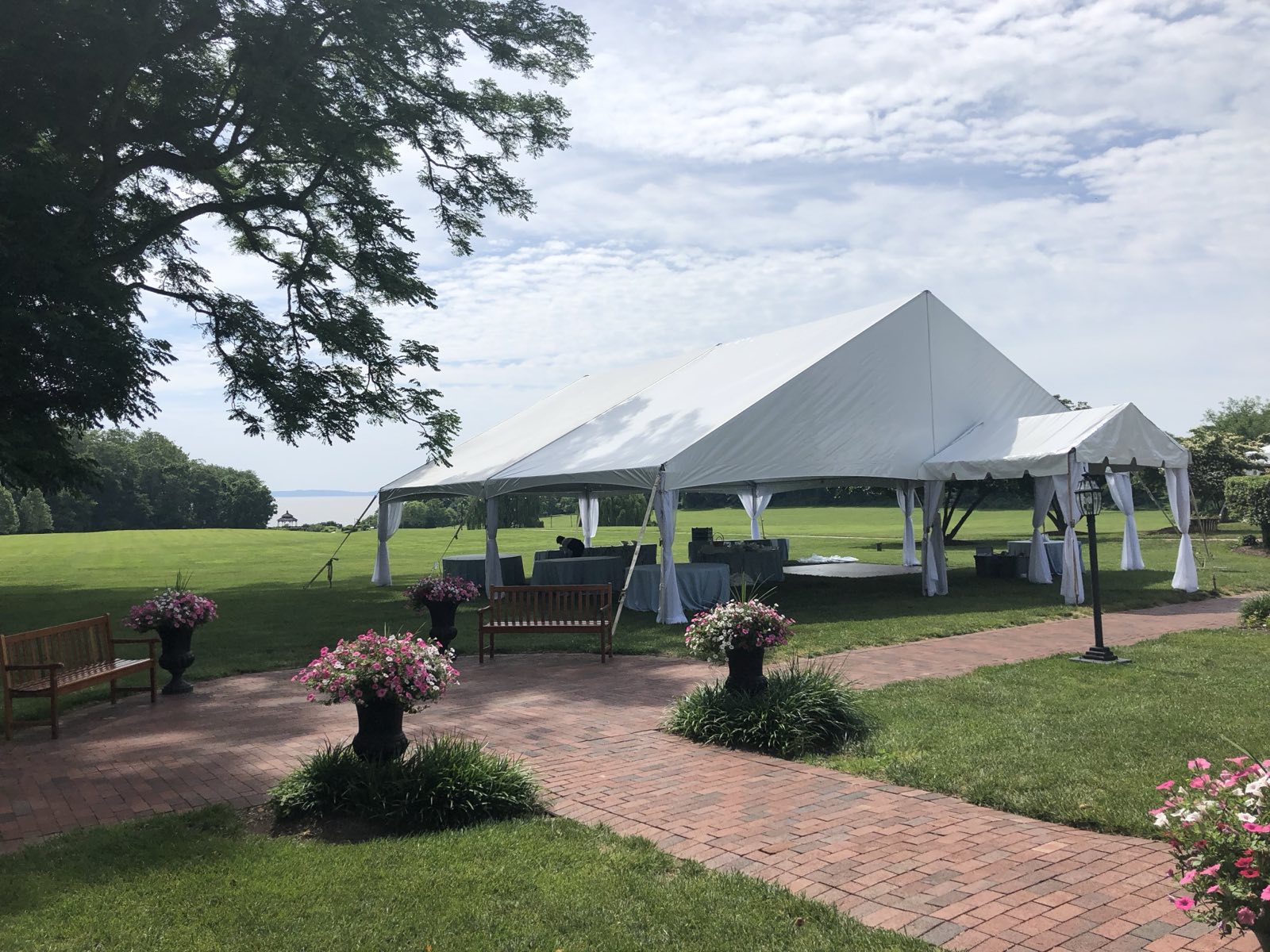 Frame tent with a brick garden path entrance