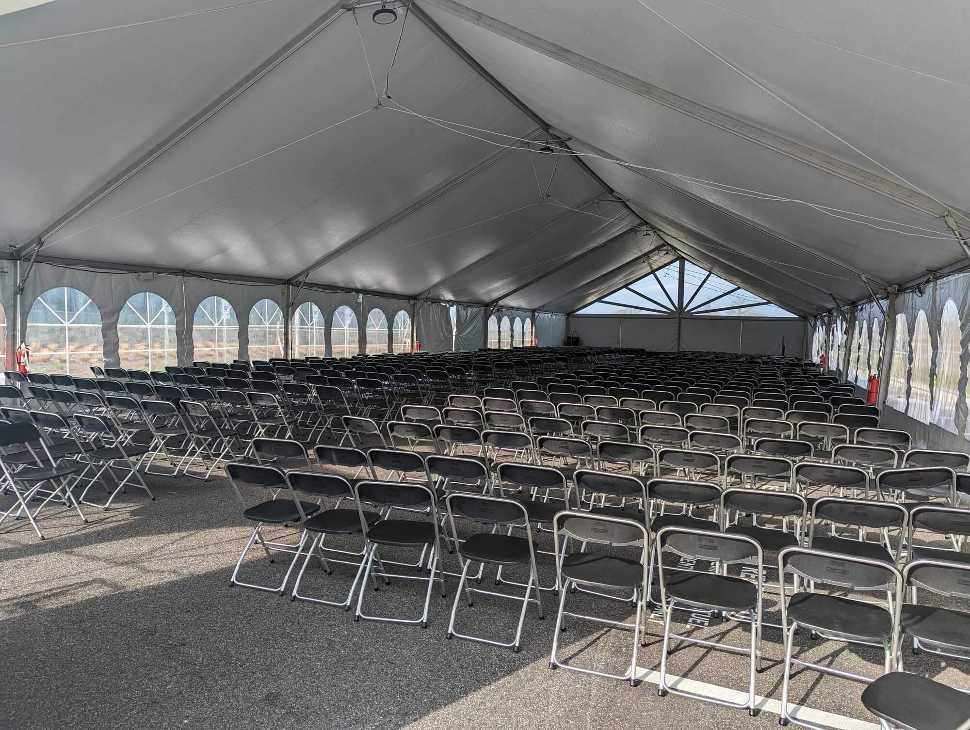 Ceremony seating under a frame tent