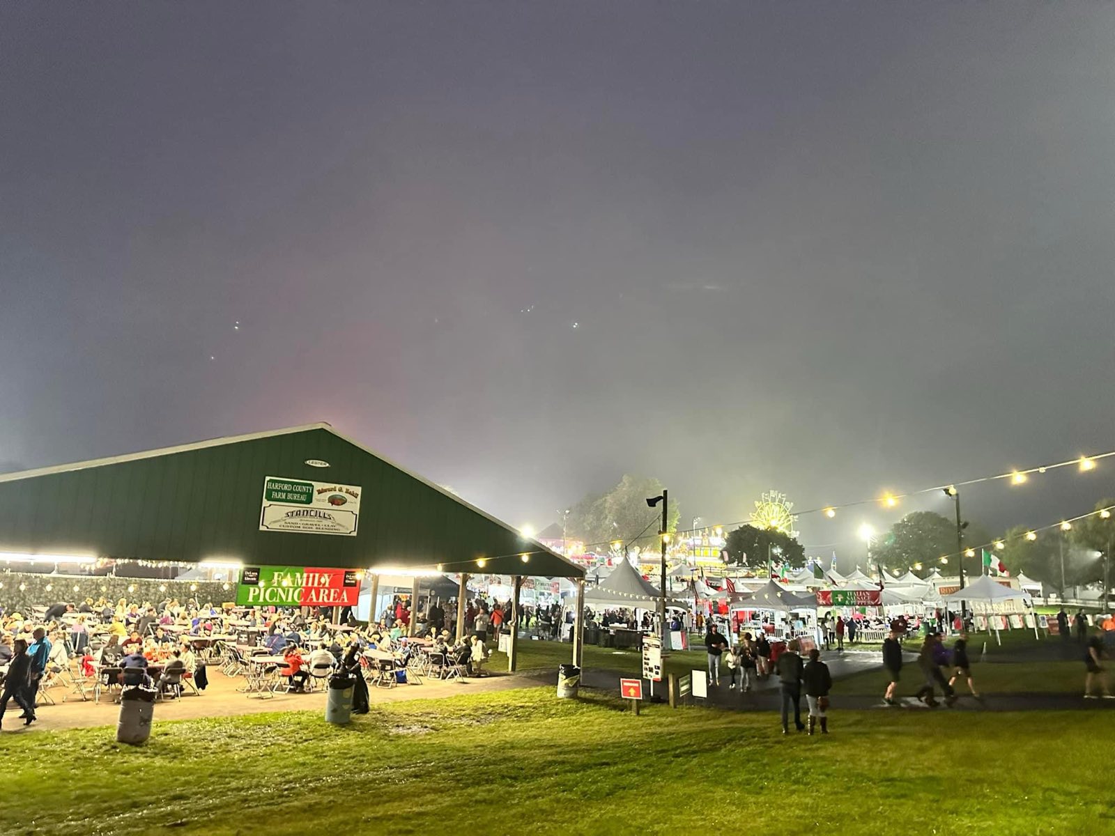 Festival food tents lit up at night