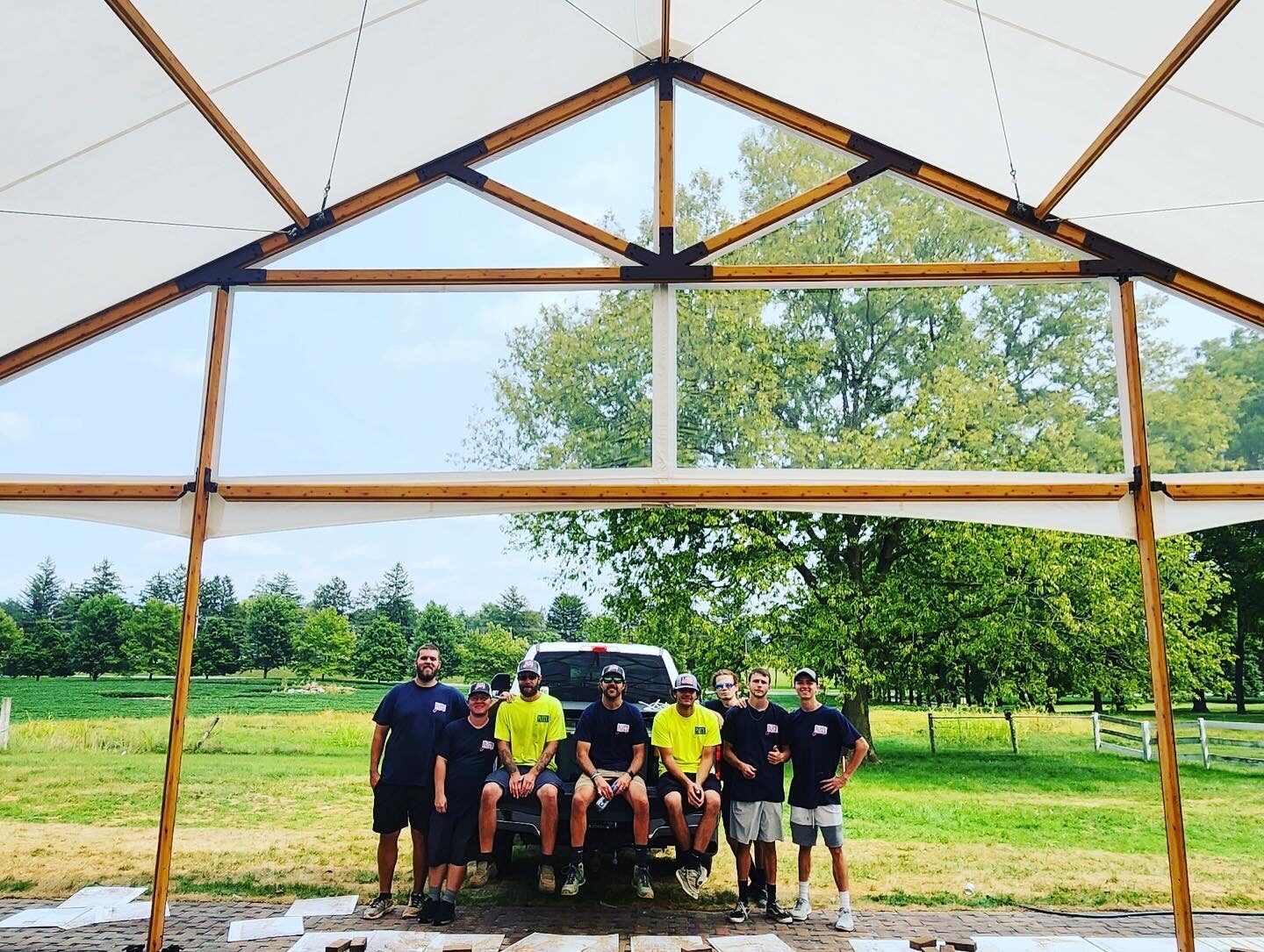 The Party Party crew under a Timbertrac frame tent