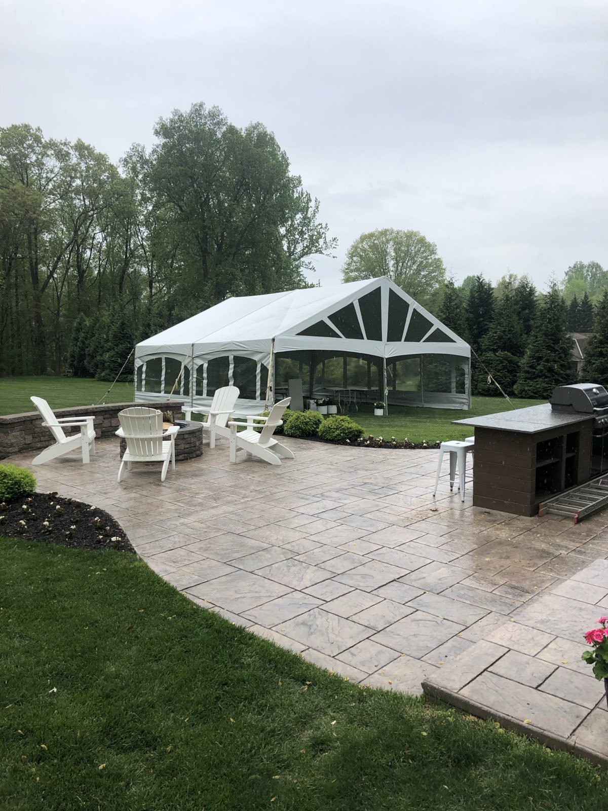 Patio tent over an outdoor kitchen and seating