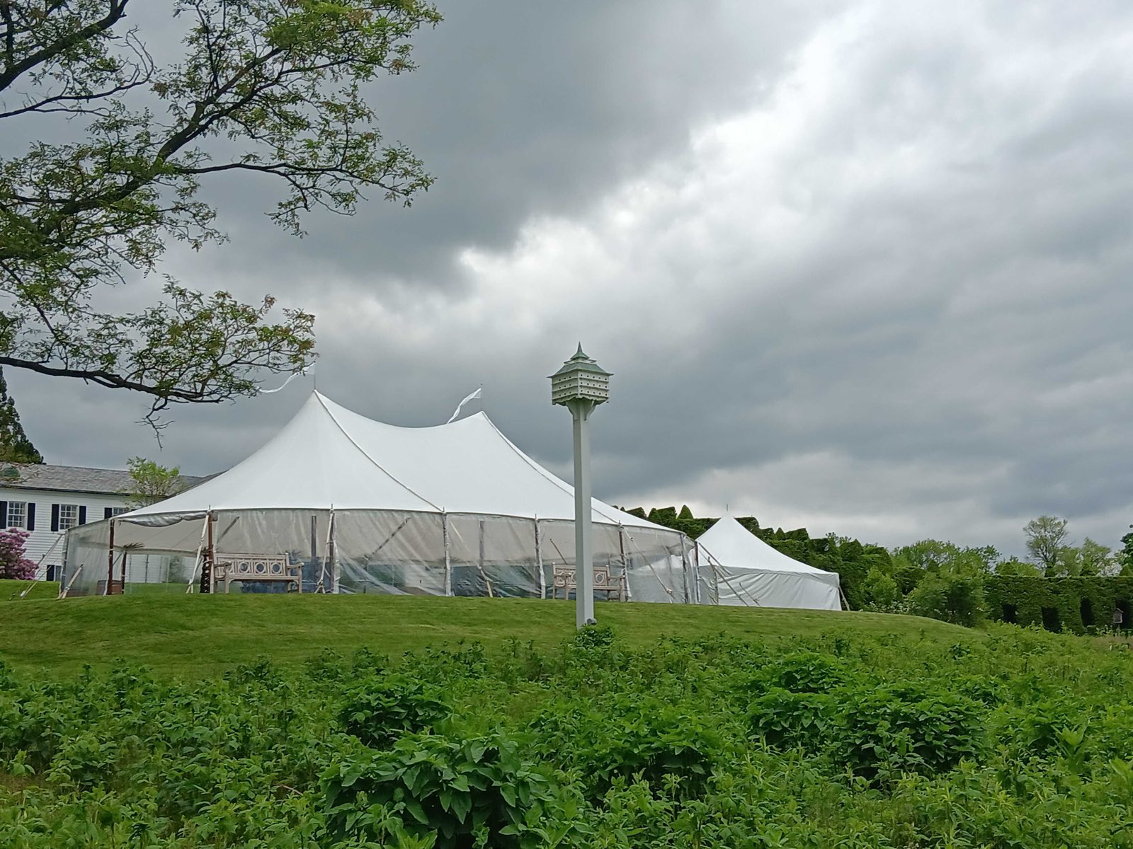 Sailcloth tent under a storm sky