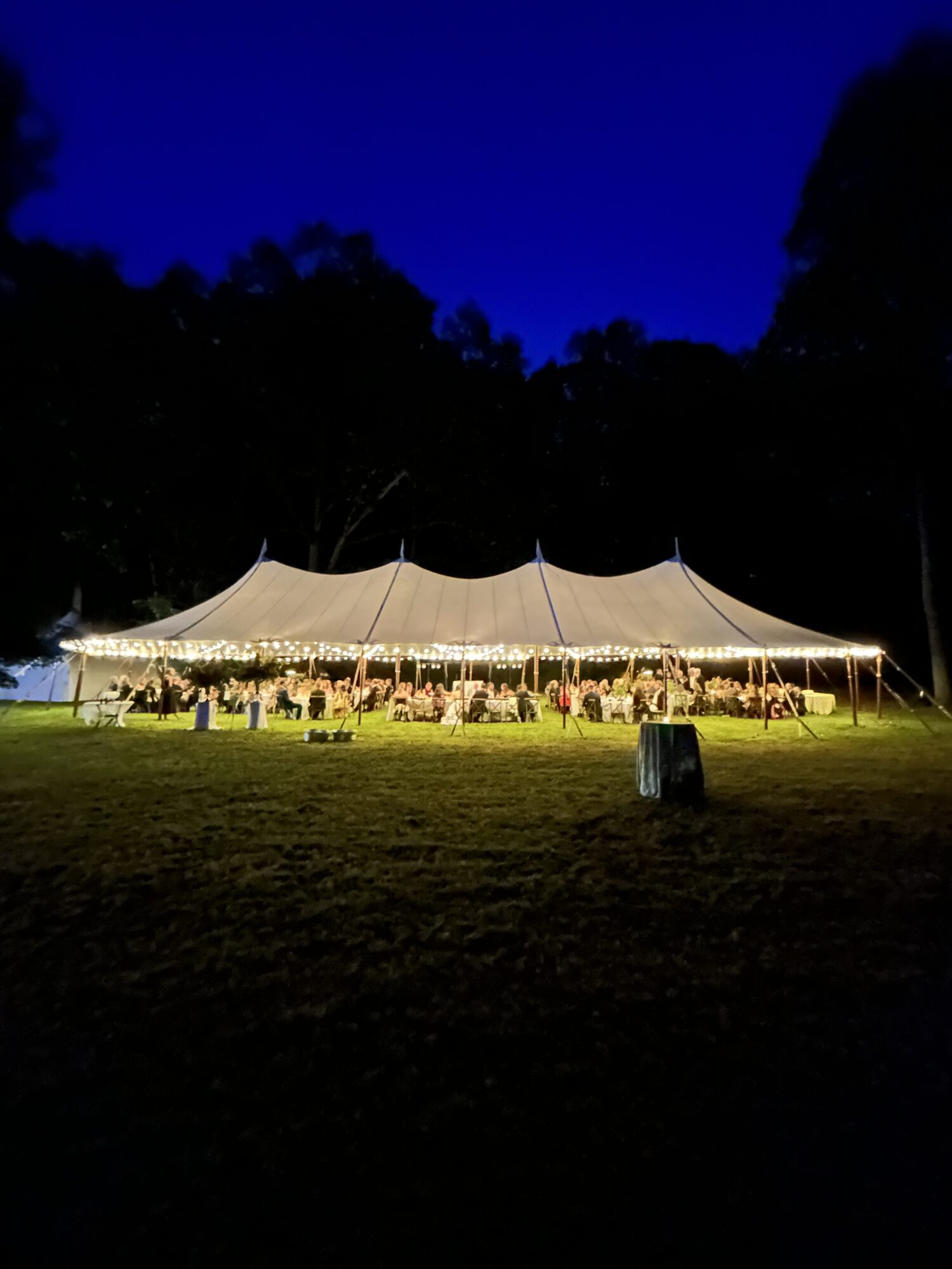 Sailcloth wedding tent at dusk
