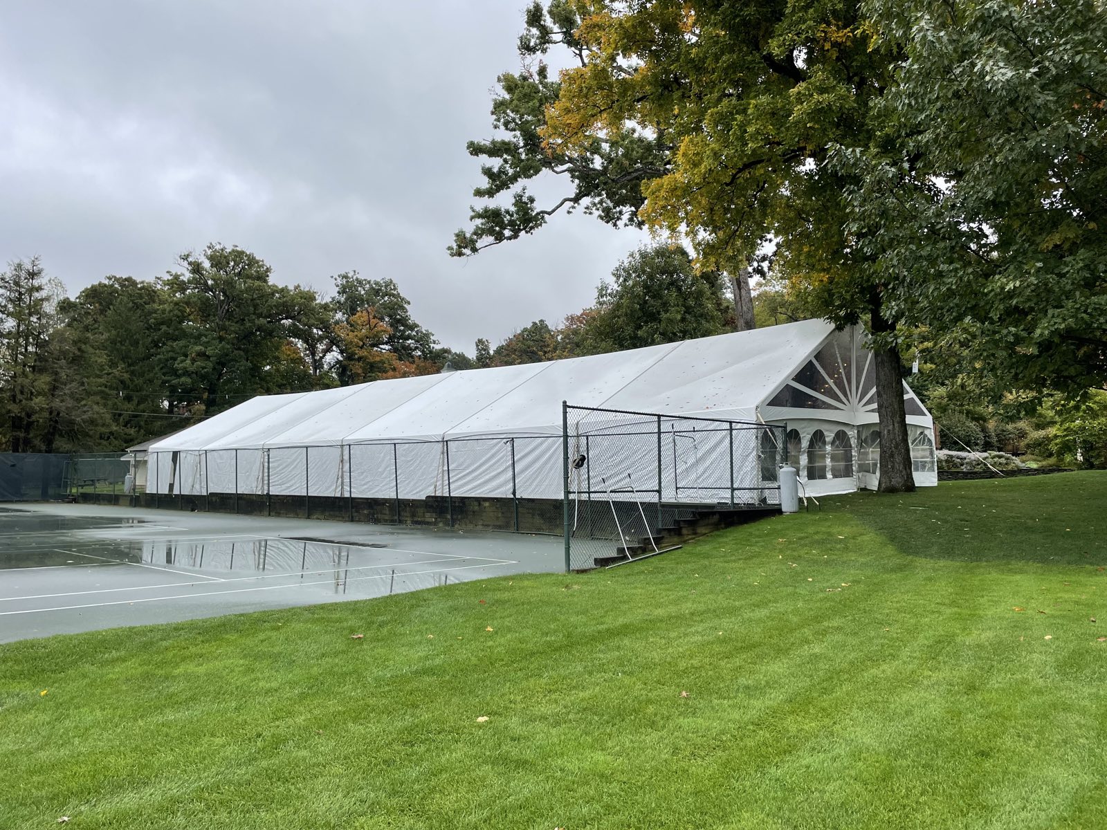 Structure tent reflected in a pond